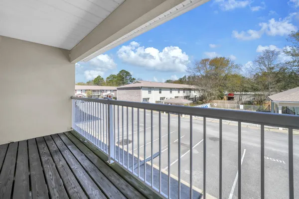 a view of a backyard with swimming pool