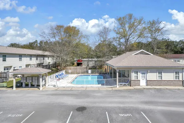 a kitchen with stainless steel appliances kitchen island granite countertop a sink and cabinets