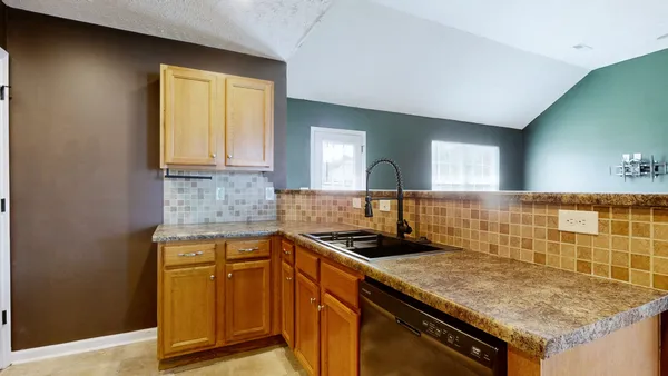 a kitchen with a sink and cabinets
