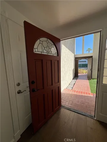 a bedroom with a bed and a mirror