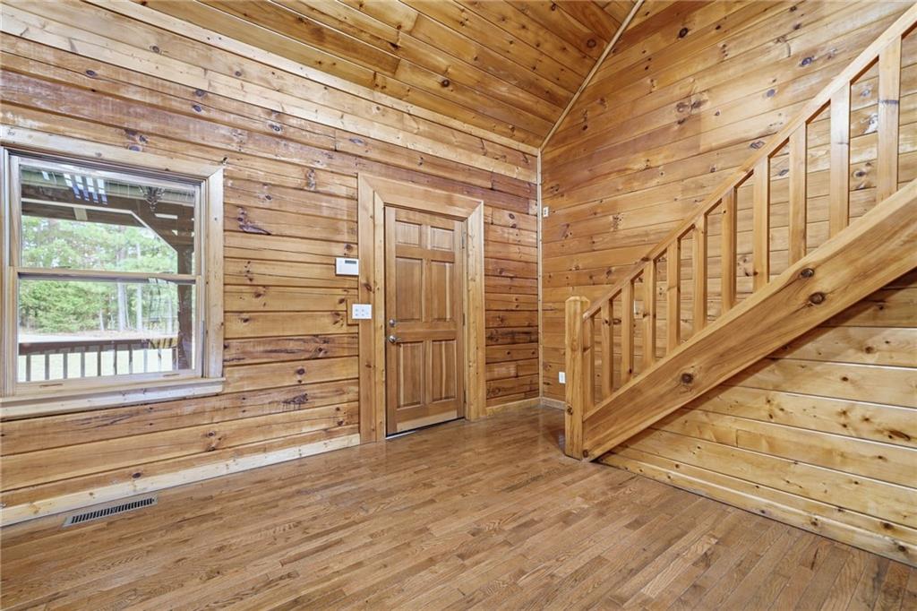 1384 Crystal Lane Northeast Ranger, GA 30734 - Photo 12 of 53 a view of a balcony with wooden floor and stairs