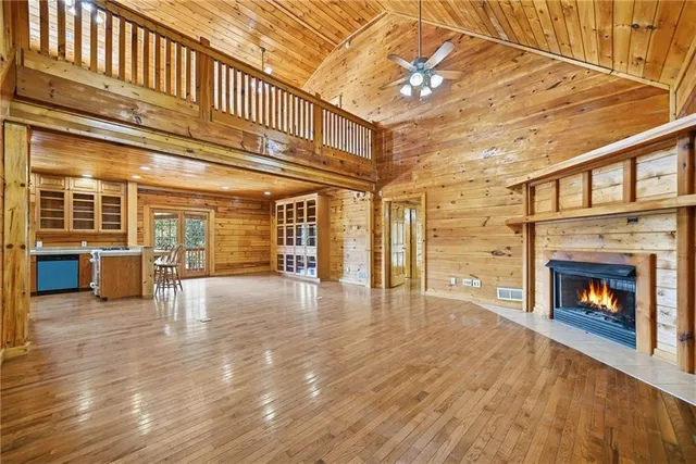 a living room with a fireplace in front of a window