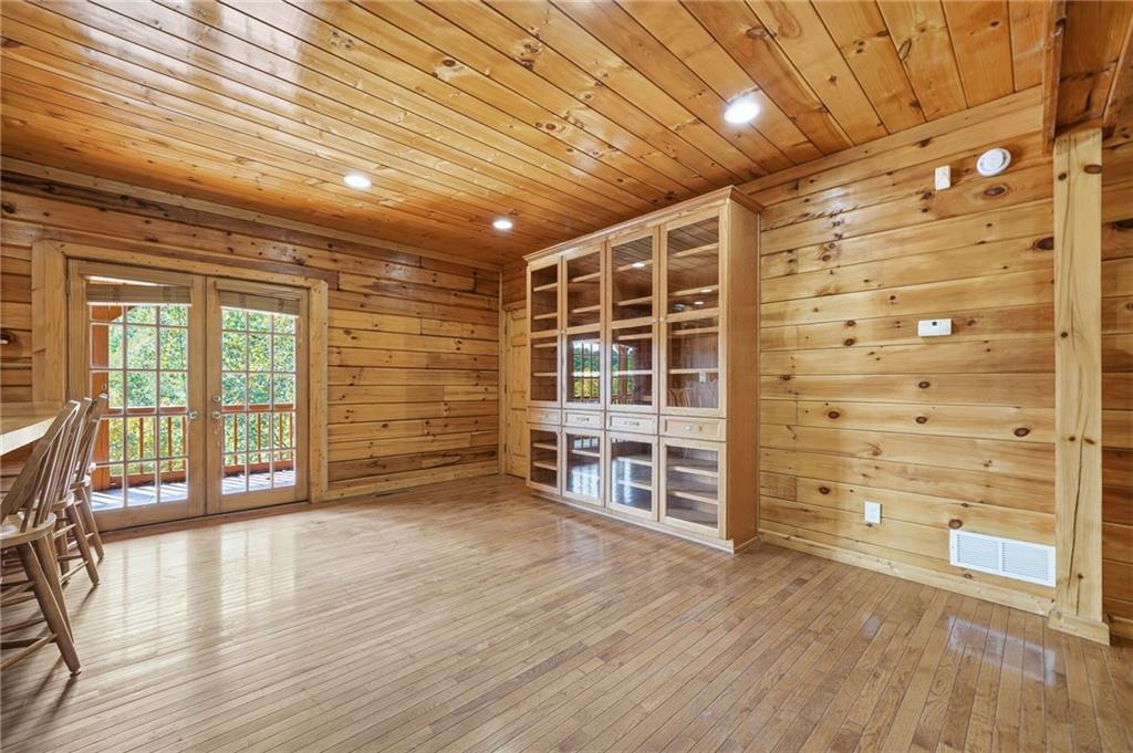 1384 Crystal Lane Northeast Ranger, GA 30734 - Photo 16 of 53 wooden floor in an empty room with a window