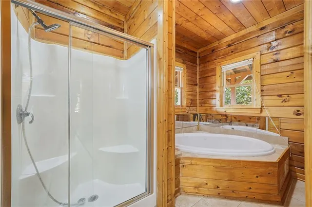 a bathroom with a tub and a sink