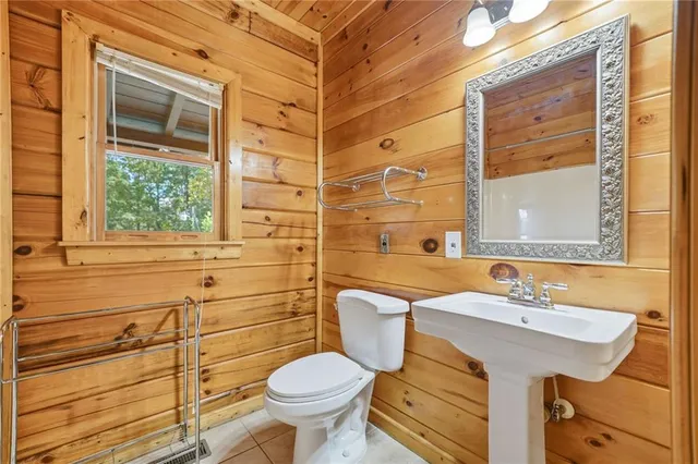 a bathroom with a bathtub and window