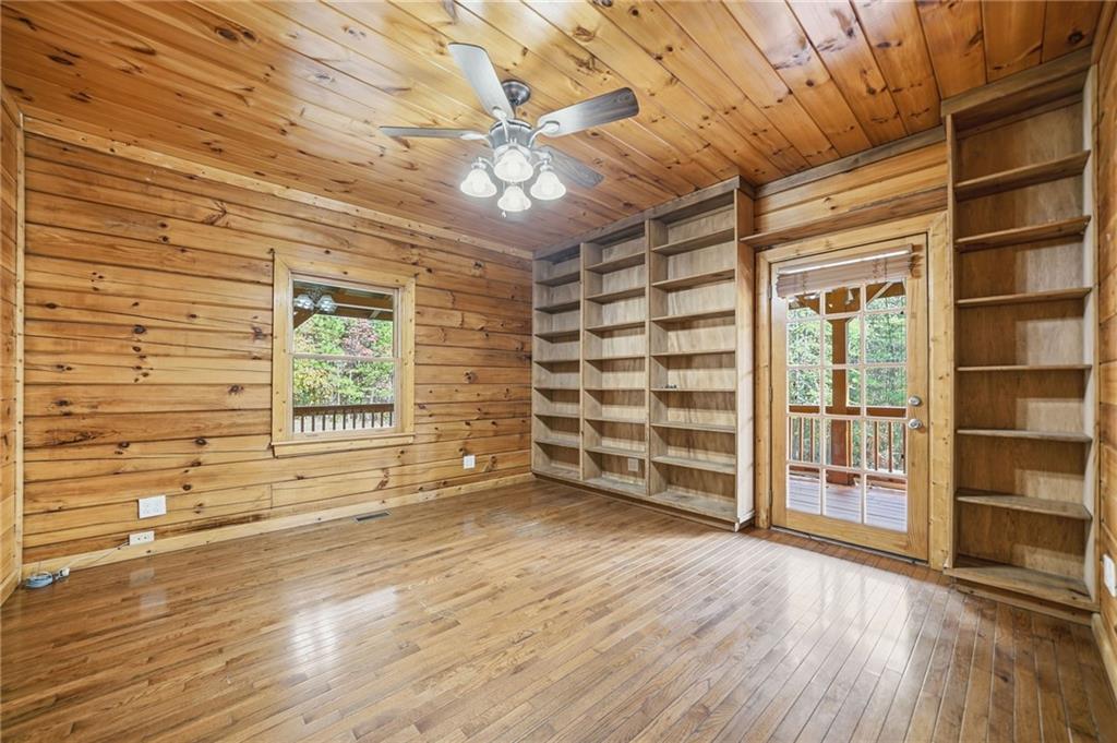 1384 Crystal Lane Northeast Ranger, GA 30734 - Photo 31 of 53 a view of an empty room with a window and wooden floor