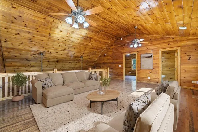 a view of a livingroom with an empty space and wooden floor