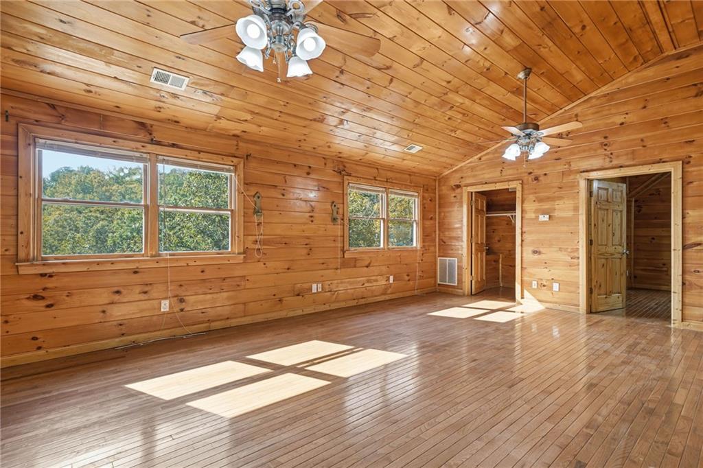 1384 Crystal Lane Northeast Ranger, GA 30734 - Photo 33 of 53 a view of an empty room with wooden floor and a window