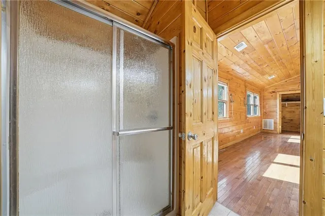 a room with a fireplace and a window