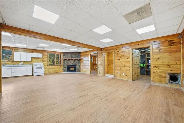 an aerial view of a house with a yard and swimming pool