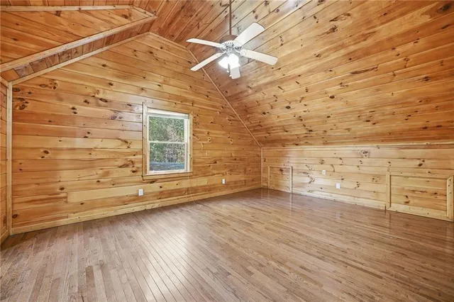 a view of an empty room with a fireplace