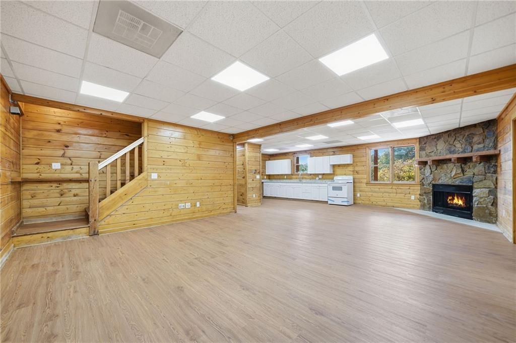 1384 Crystal Lane Northeast Ranger, GA 30734 - Photo 44 of 53 a view of an empty room with fireplace and wooden floor