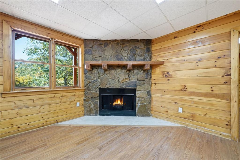 1384 Crystal Lane Northeast Ranger, GA 30734 - Photo 45 of 53 a room with a fireplace and a window