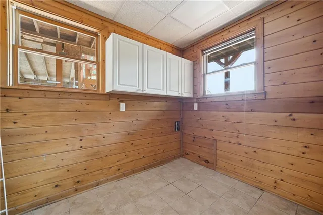 a view of an empty room and wooden floor
