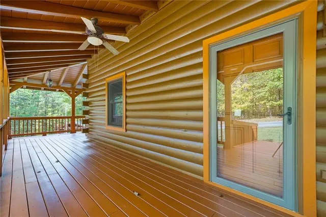 a view of a room with wooden floor and windows
