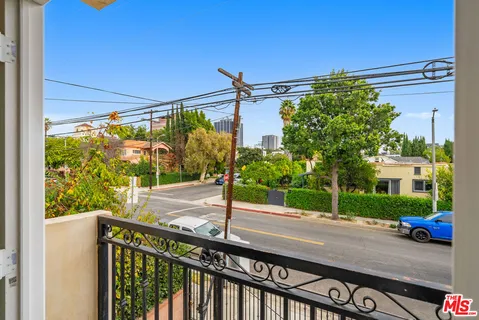 a view of a street from a balcony