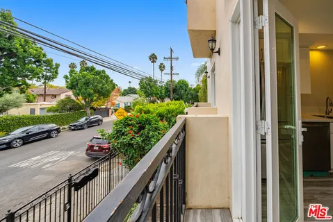 a kitchen with a sink cabinets and a window