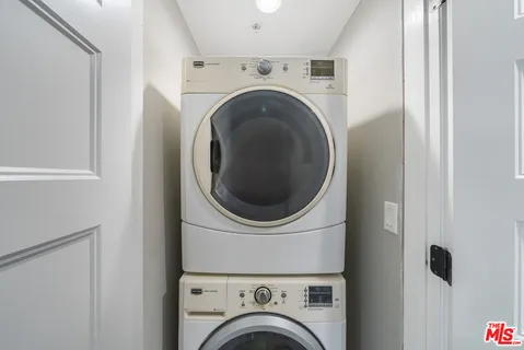 a view of balcony with wooden floor and fence