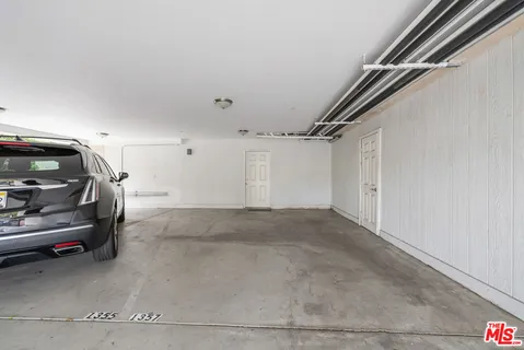 a front view of a building with a garden