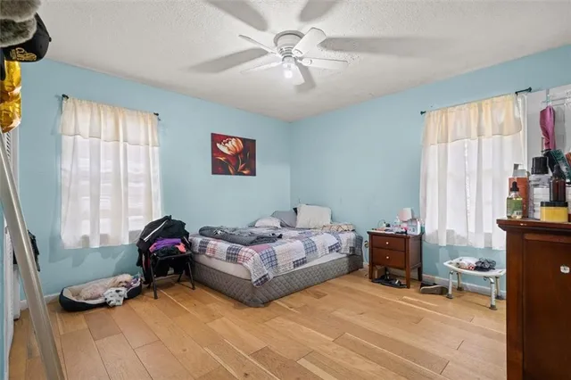 a bedroom with furniture and a window