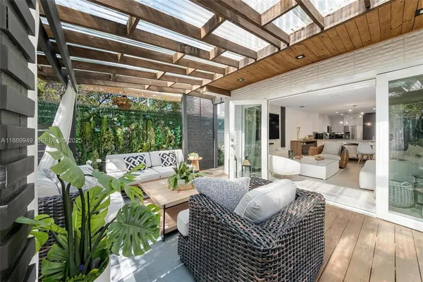 a outdoor living space with furniture and a potted plant