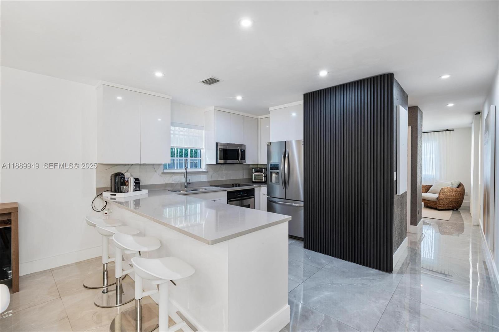 2752 Southwest 11th Street Miami, FL 33135 - Photo 14 of 48 a kitchen with a refrigerator and a sink