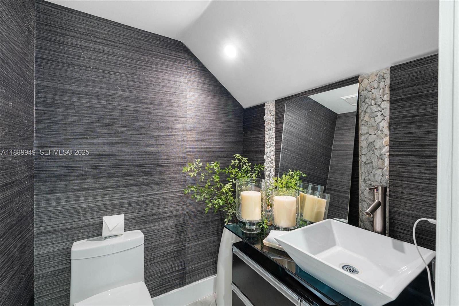 2752 Southwest 11th Street Miami, FL 33135 - Photo 17 of 48 a bathroom with a sink toilet and mirror