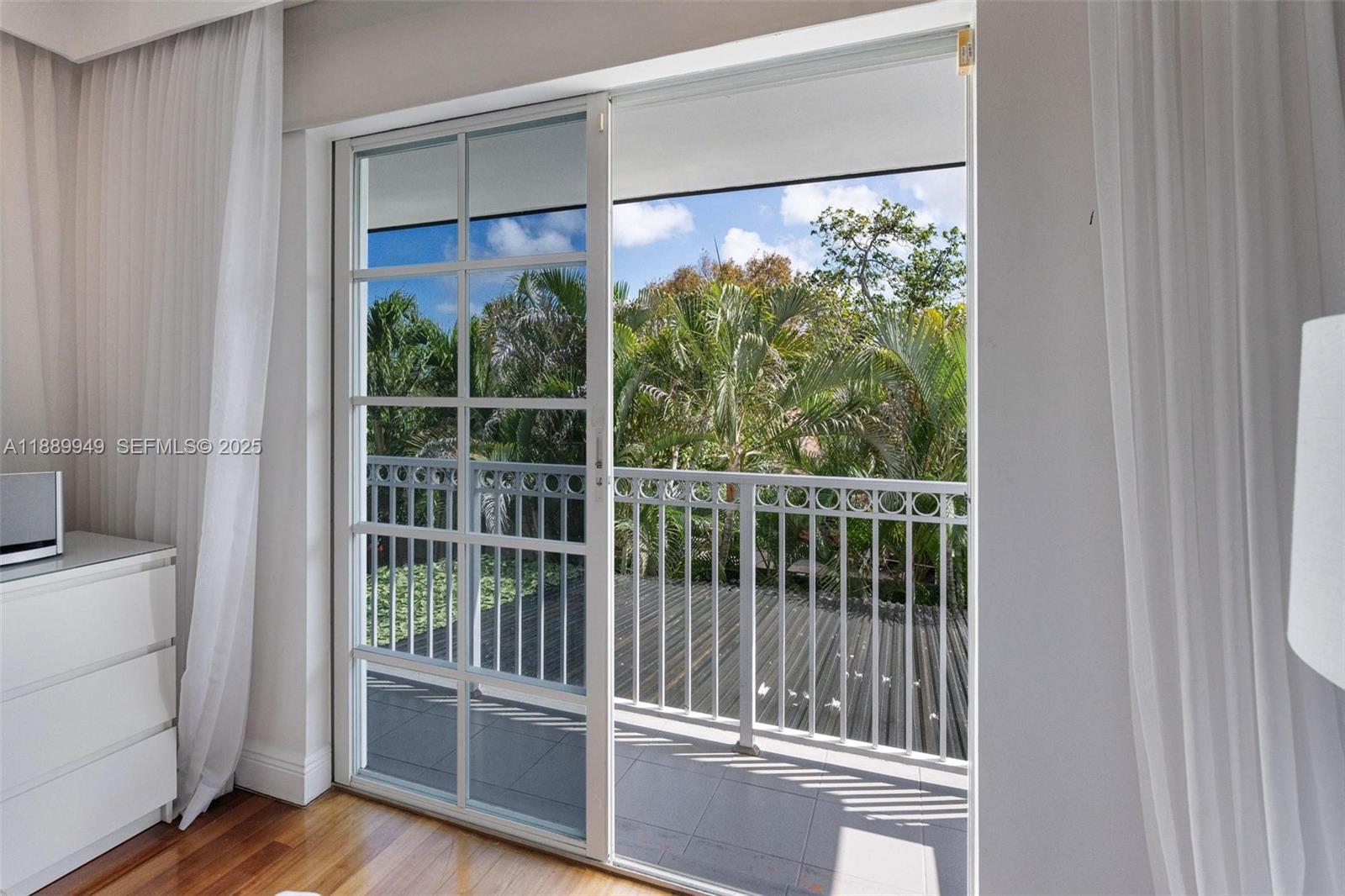 2752 Southwest 11th Street Miami, FL 33135 - Photo 21 of 48 a view of a room with a large window and wooden floor