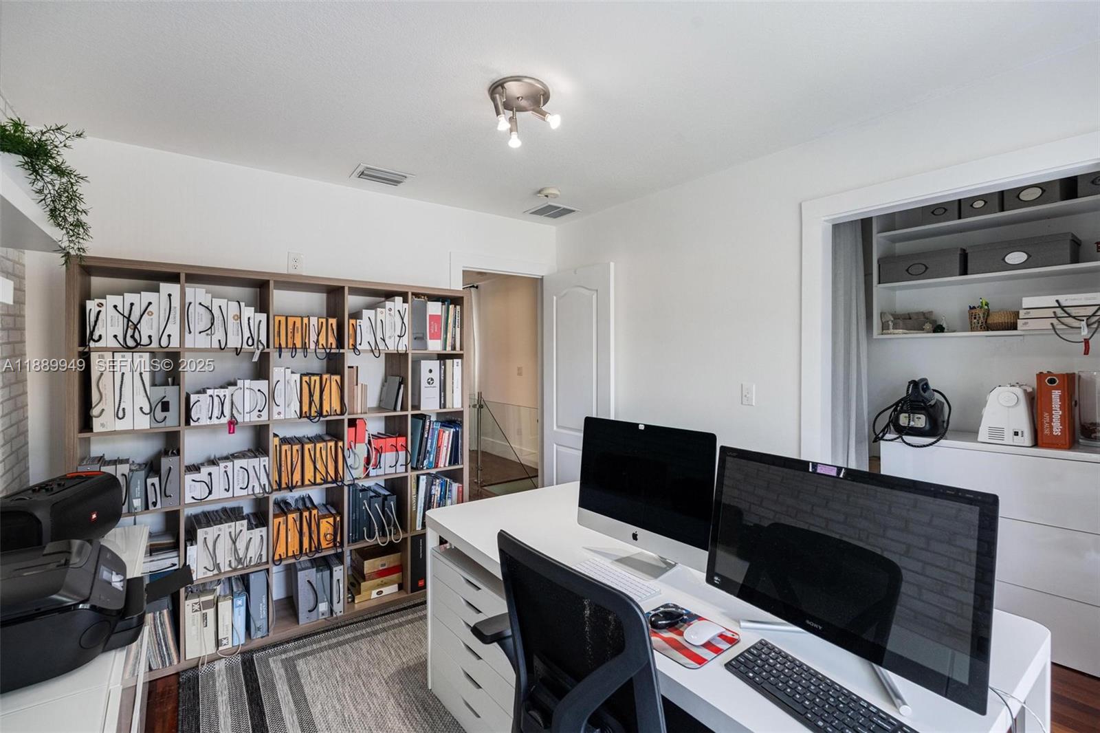 2752 Southwest 11th Street Miami, FL 33135 - Photo 24 of 48 a work room with furniture and book shelf