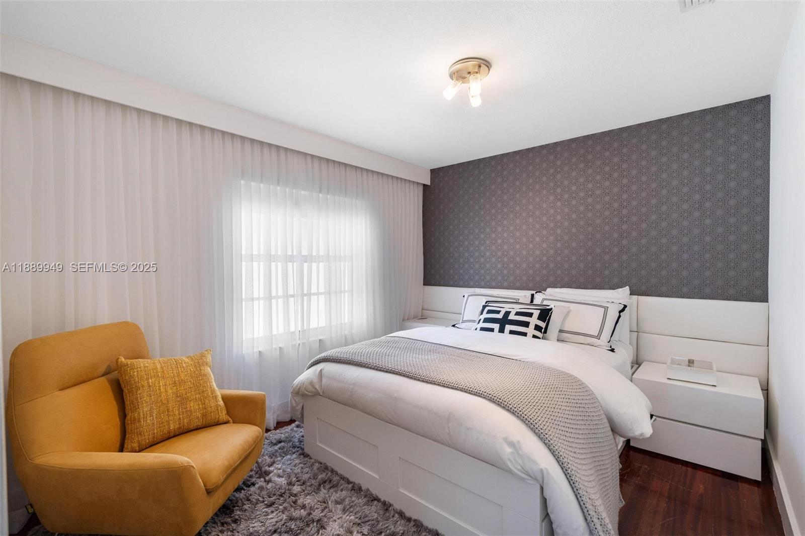 2752 Southwest 11th Street Miami, FL 33135 - Photo 25 of 48 a bedroom with a bed and a couch