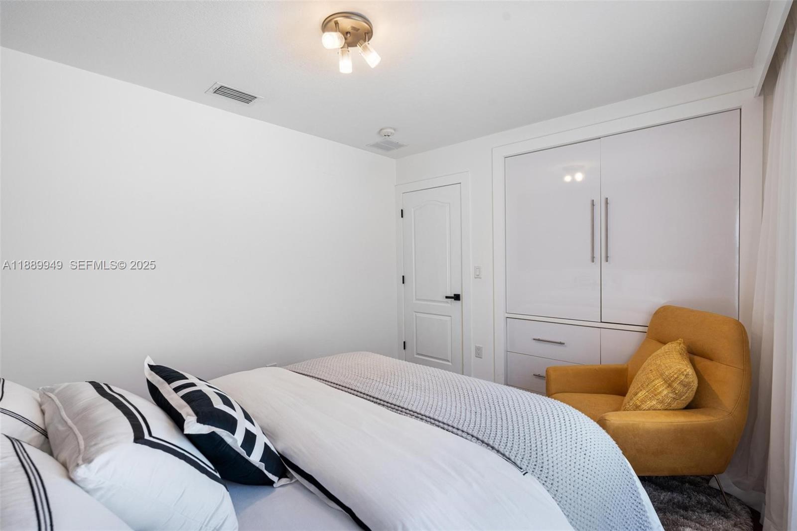 2752 Southwest 11th Street Miami, FL 33135 - Photo 26 of 48 a bedroom with a bed and a couch