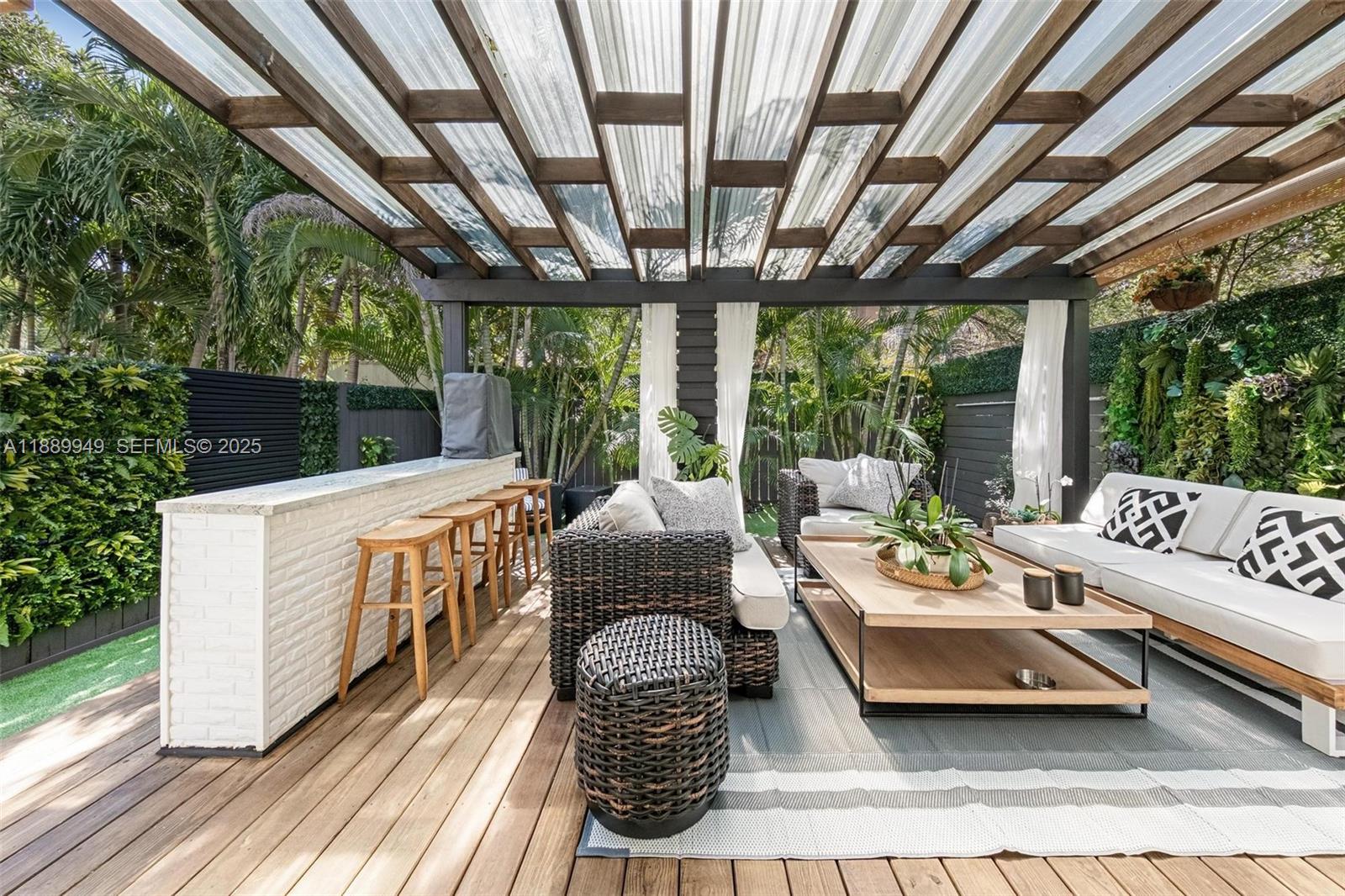 2752 Southwest 11th Street Miami, FL 33135 - Photo 30 of 48 a balcony with furniture and a garden