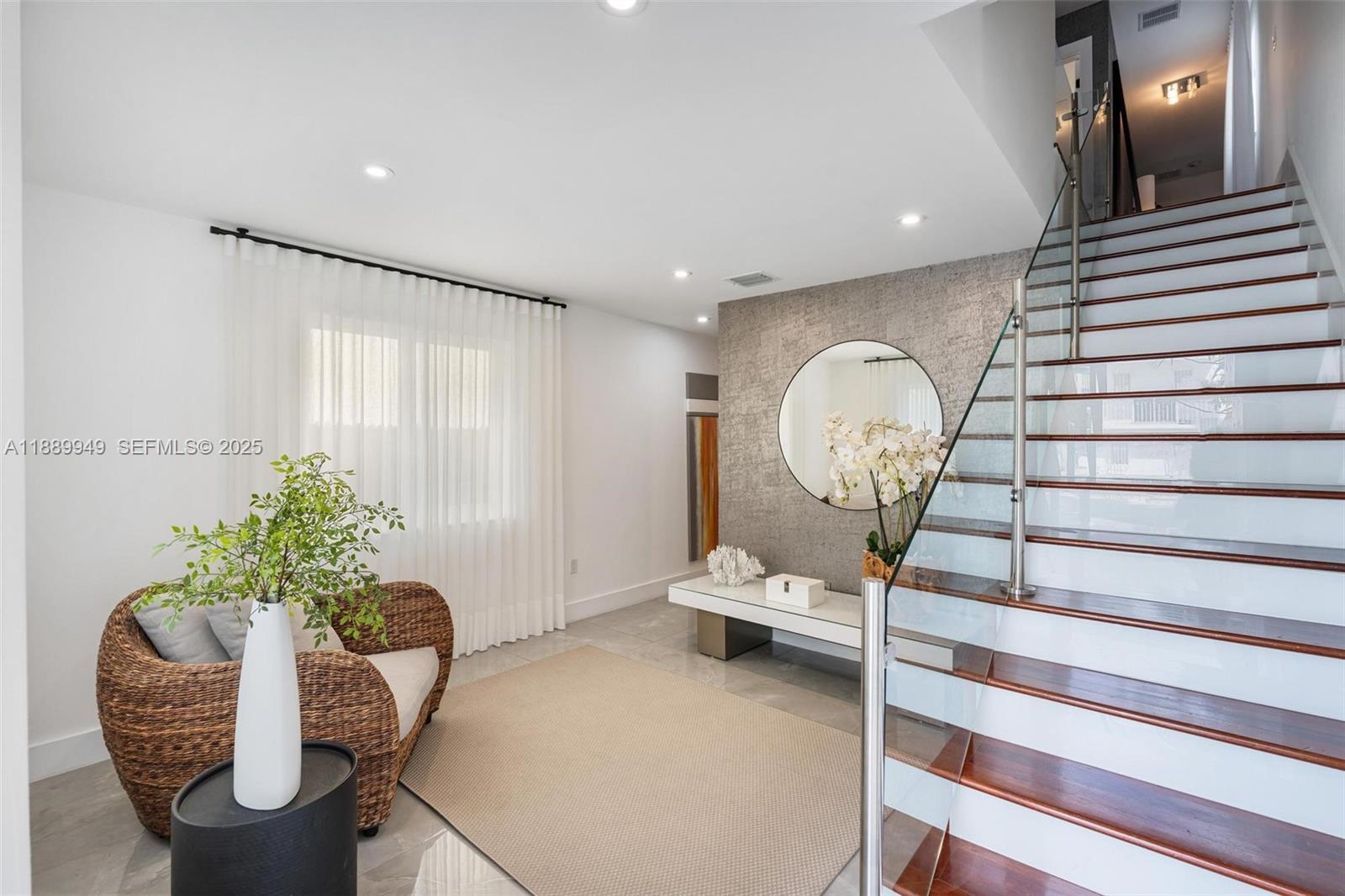2752 Southwest 11th Street Miami, FL 33135 - Photo 3 of 48 a living room with furniture and a chandelier