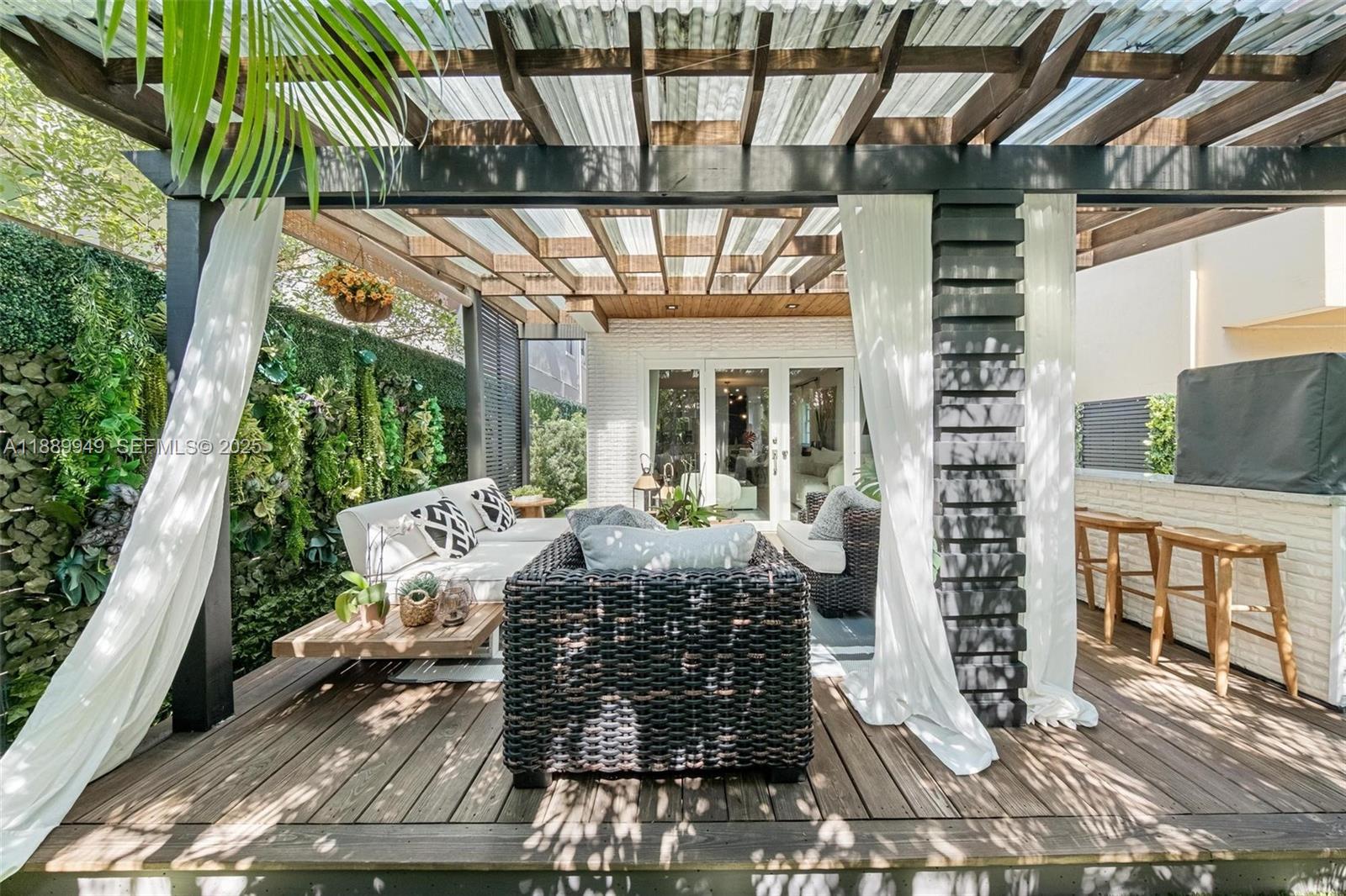 2752 Southwest 11th Street Miami, FL 33135 - Photo 38 of 48 a view of porch with a table and chairs