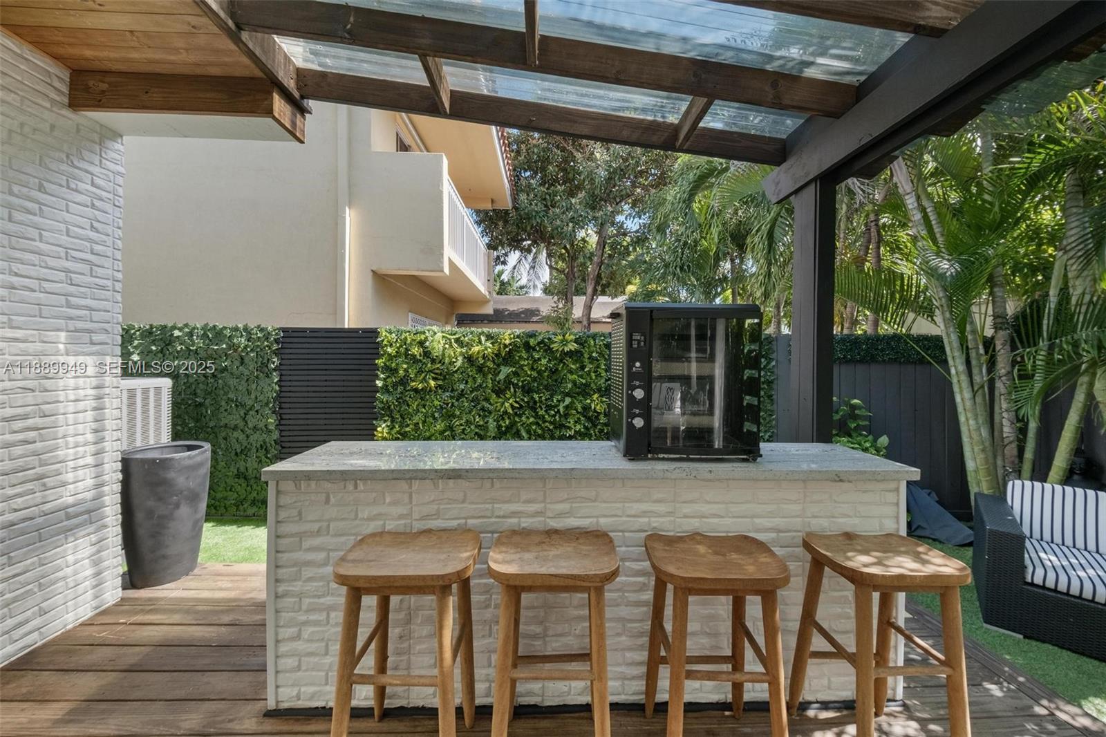 2752 Southwest 11th Street Miami, FL 33135 - Photo 42 of 48 a view of an outdoor dining space with a table and chairs