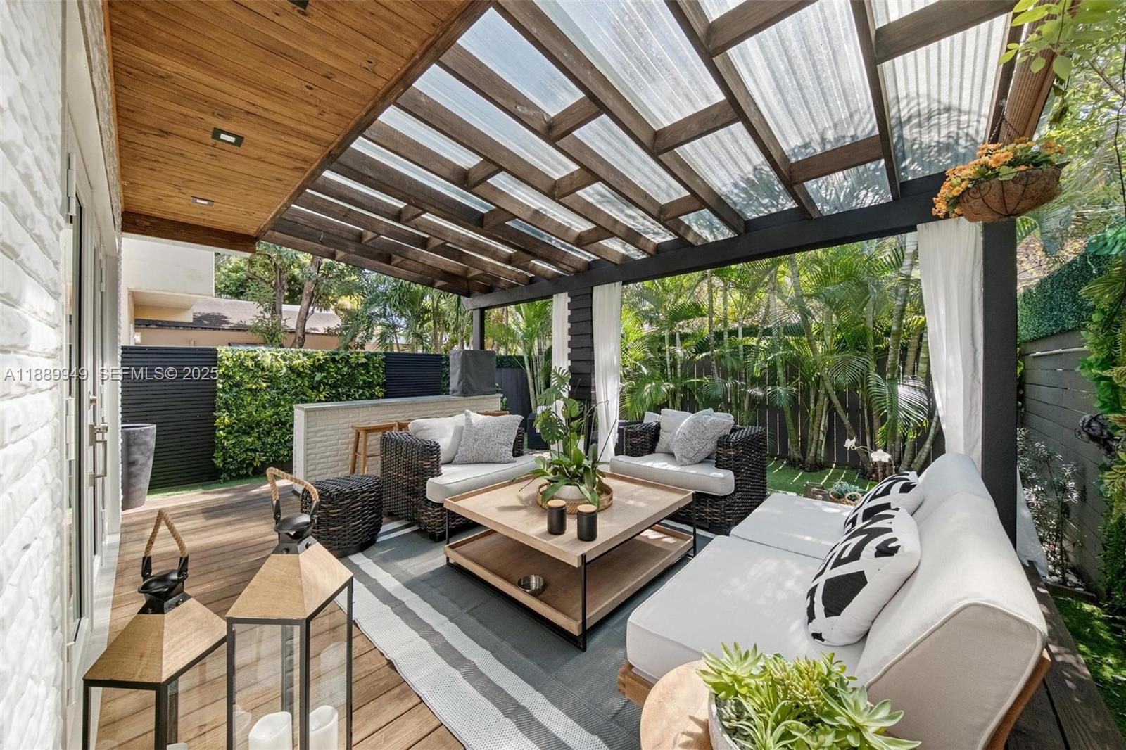 2752 Southwest 11th Street Miami, FL 33135 - Photo 43 of 48 a view of a patio with couches chairs and a potted plant