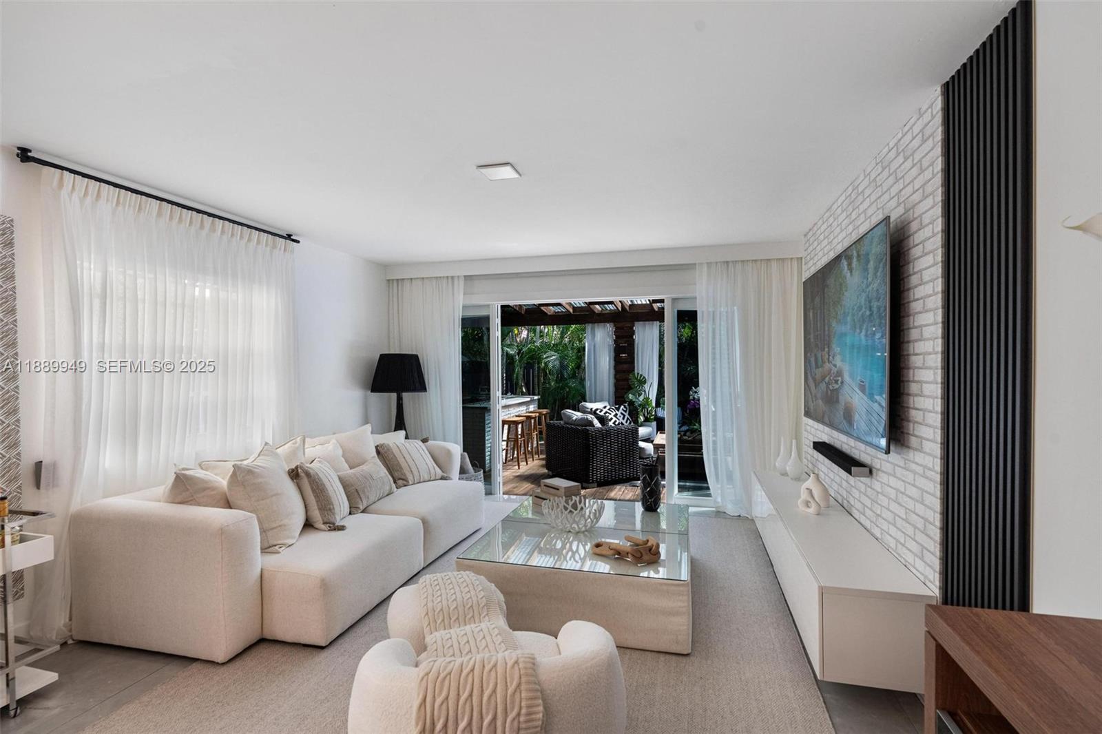 2752 Southwest 11th Street Miami, FL 33135 - Photo 7 of 48 a living room with furniture large window and flat screen tv