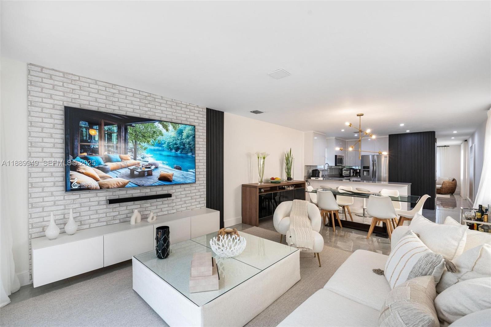 2752 Southwest 11th Street Miami, FL 33135 - Photo 10 of 48 a living room with furniture and a flat screen tv