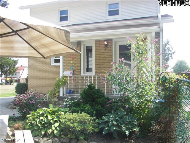 118 Canton Road Akron, OH 44312 - Photo 19 of 24 View of covered back porch from yard
