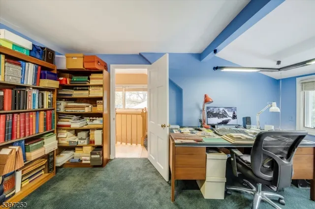a view of a workspace with furniture and toys