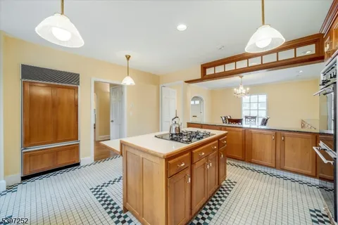 a kitchen with stainless steel appliances granite countertop a stove and a sink