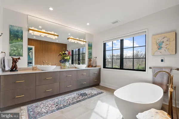a bathroom with a granite countertop sink mirror and double