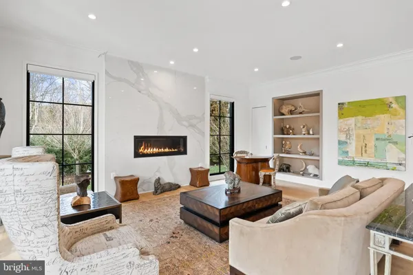 a dining room with furniture a chandelier and pool table