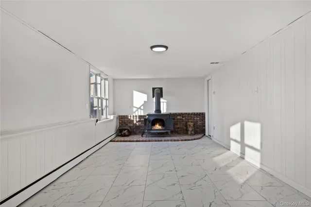 a living room with furniture a couch and a window