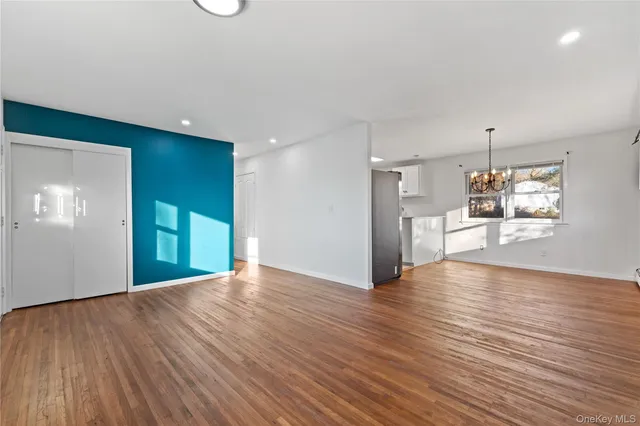 a view of a livingroom with wooden floor