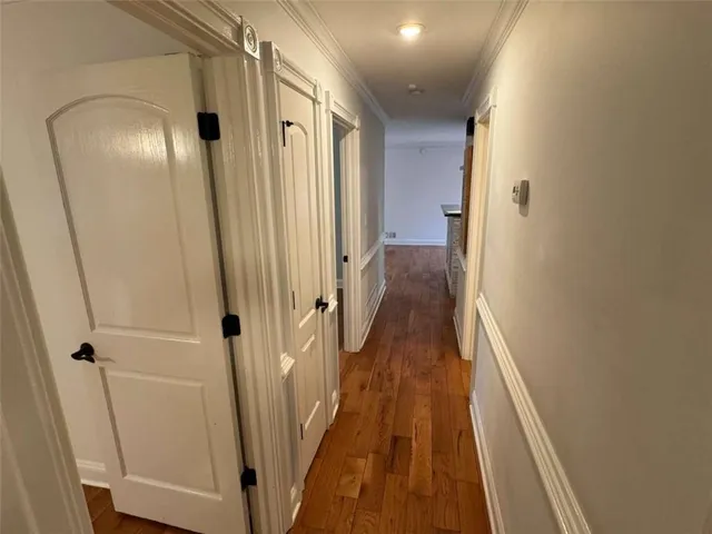 a bathroom with a sink toilet and a mirror