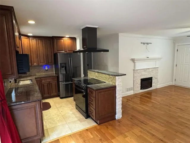 a kitchen with a stove and a refrigerator