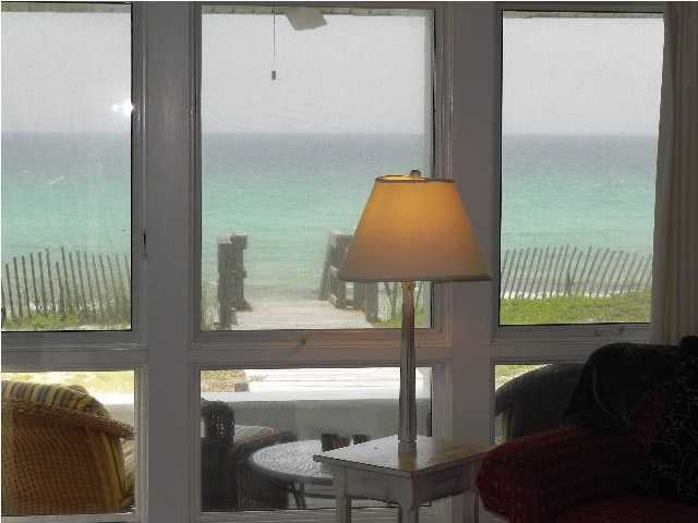 630 Blue Mountain Beach Road Santa Rosa Beach, FL 32459 - Photo 12 of 26 a living room filled with furniture and a window