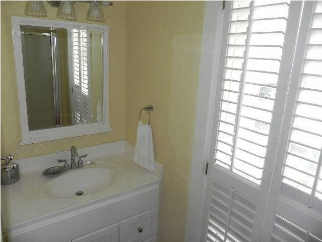 630 Blue Mountain Beach Road Santa Rosa Beach, FL 32459 - Photo 21 of 26 a bathroom with a sink and a bathtub