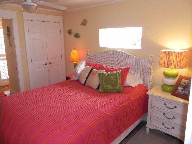 630 Blue Mountain Beach Road Santa Rosa Beach, FL 32459 - Photo 22 of 26 a bedroom with a bed and a window